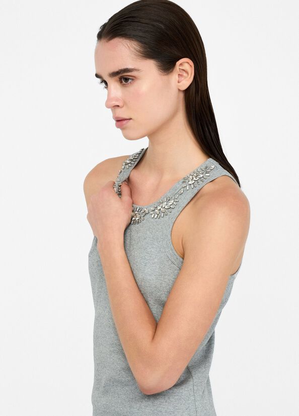 Top con applicazioni gioiello