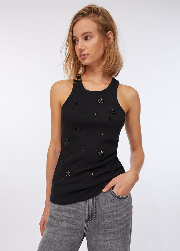 Top con applicazioni gioiello