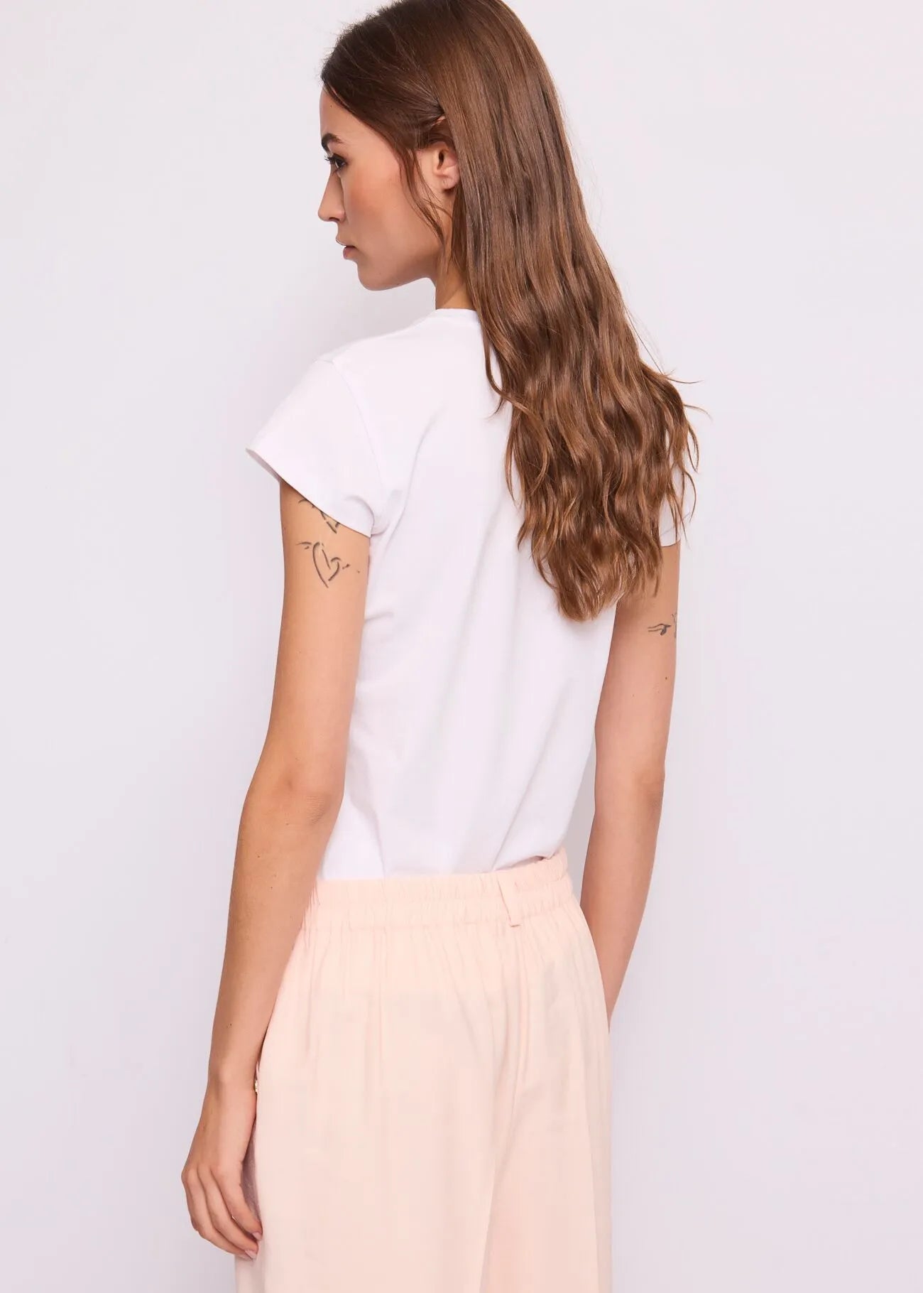 T-shirt bianca da donna con strass e logo