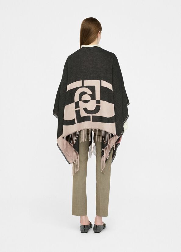 Poncho con logo e frange