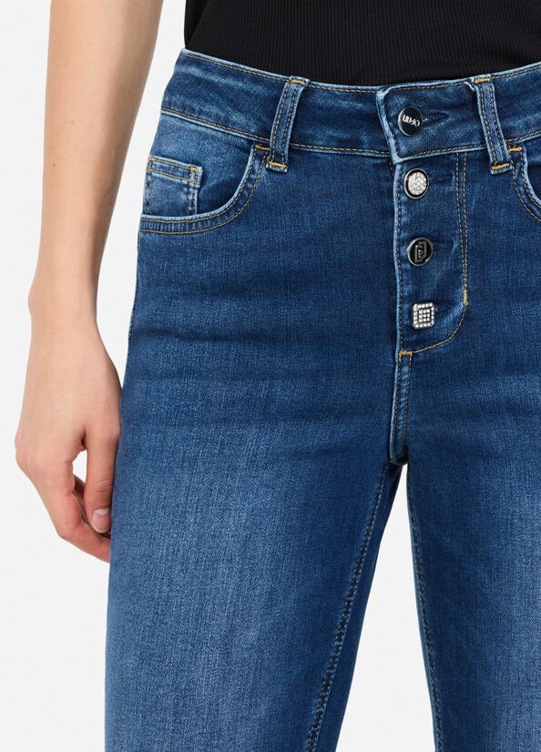 Jeans flare con bottoni gioiello