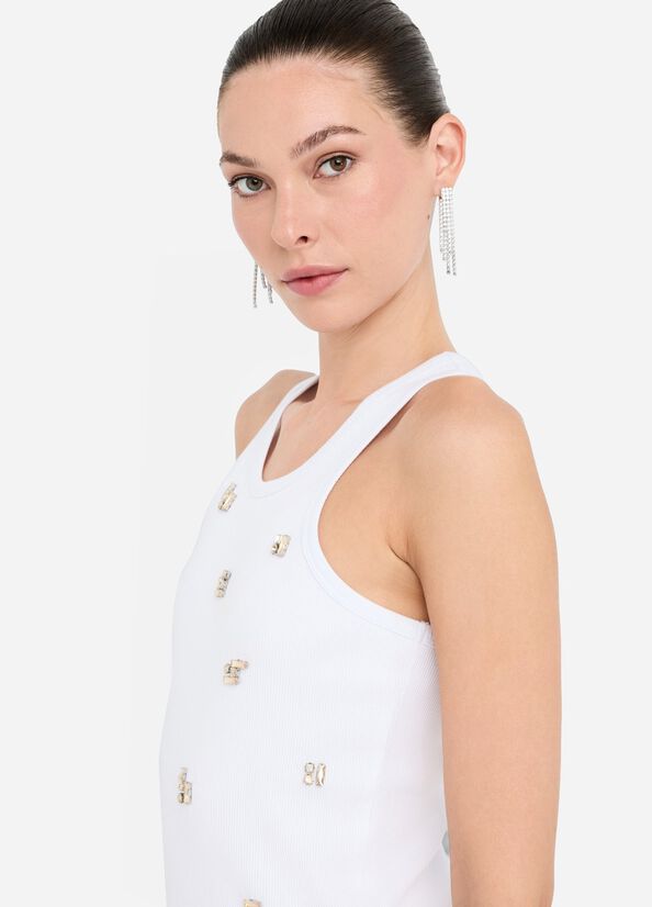 Top con applicazioni gioiello